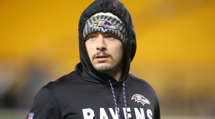 Danny Woodhead wearing a Ravens hoodie and hat.